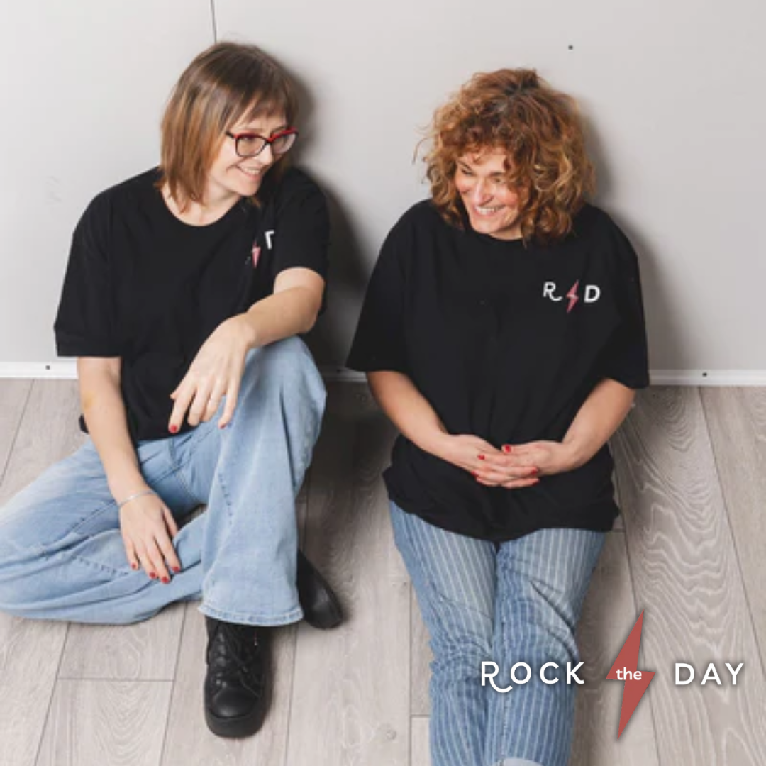 Magda and Aleks from Rock the Day in Braintree sitting on the floor looking at one another