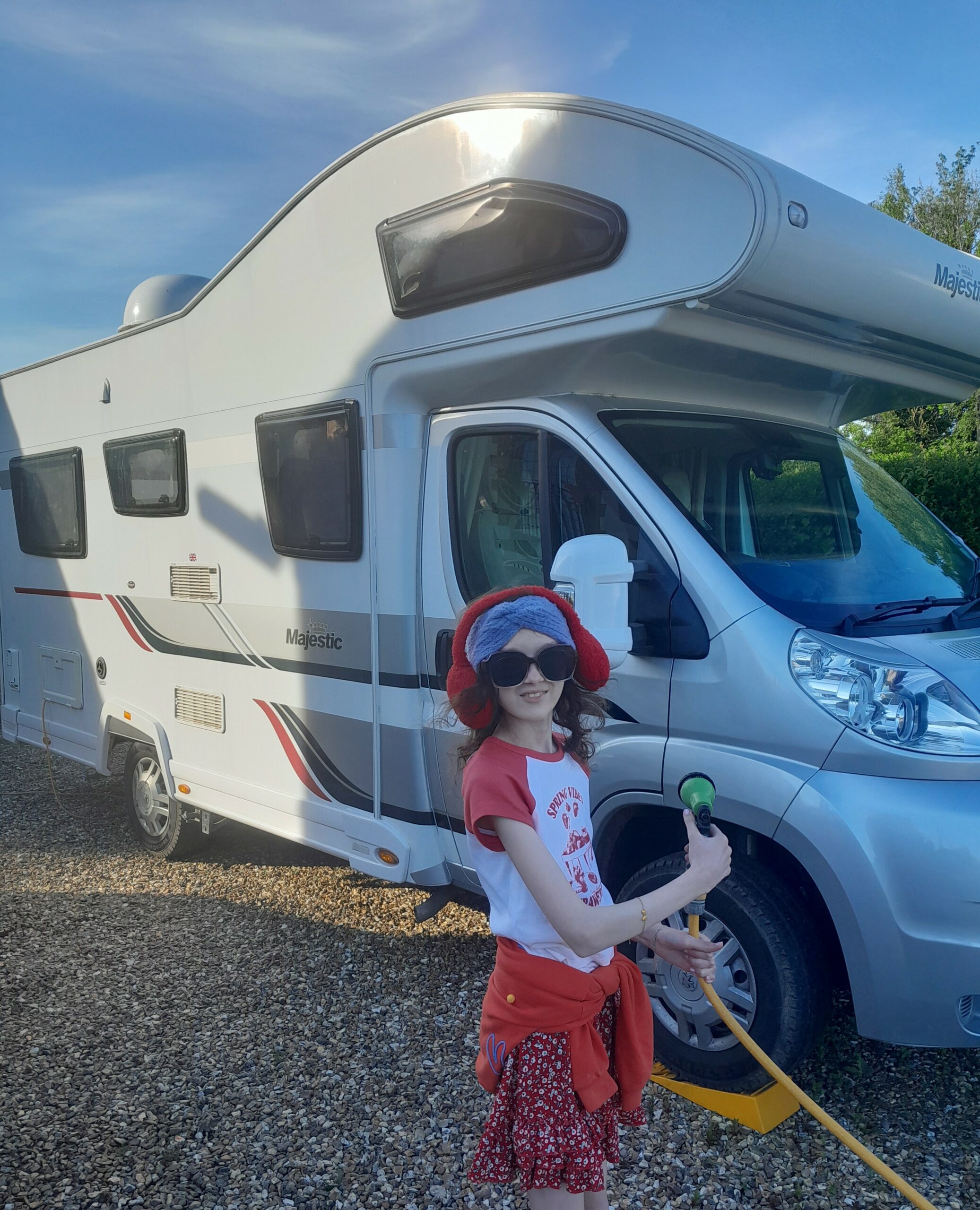 Daisy-Mae washing a motorhome